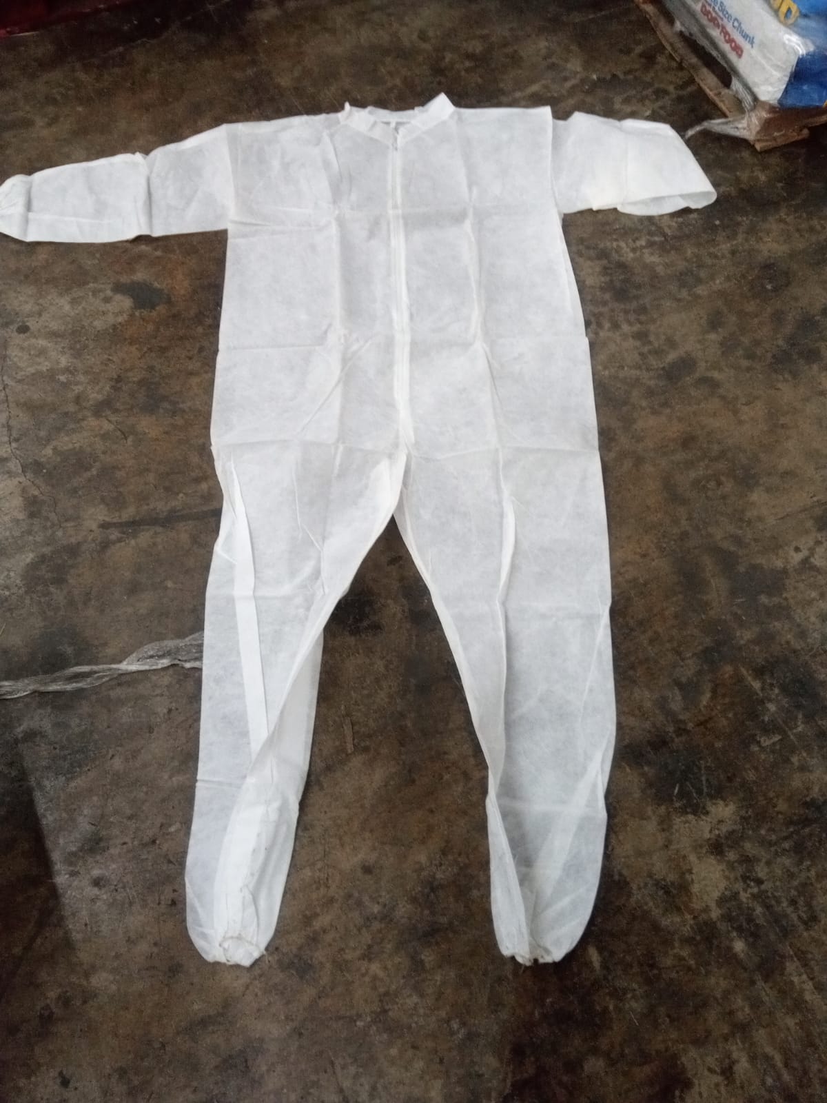 Coverall without hood & boots. PE coated 7000pcs . ISO 9002 USA